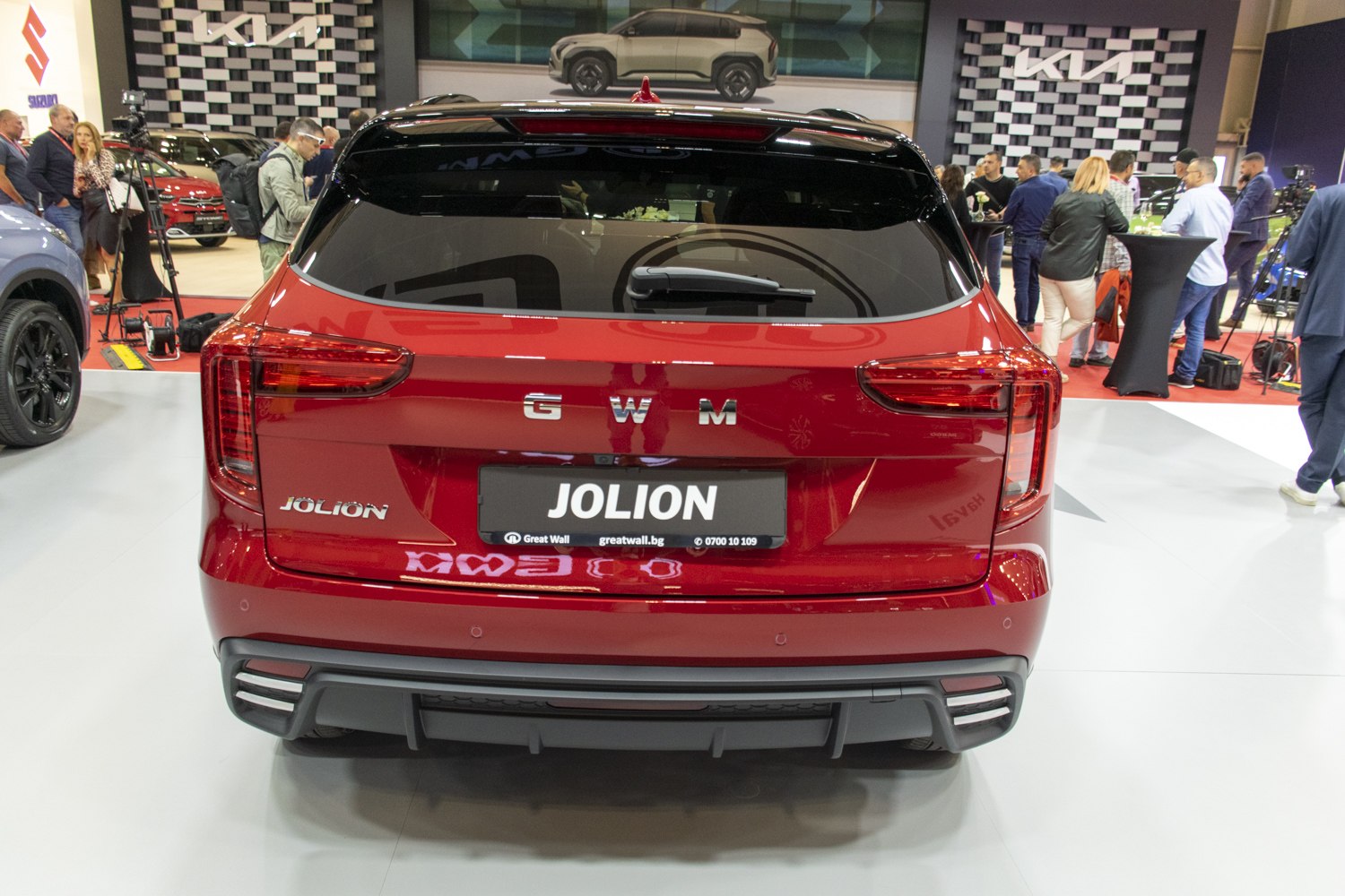 Red SUV rear with vertical taillights and sporty bumper