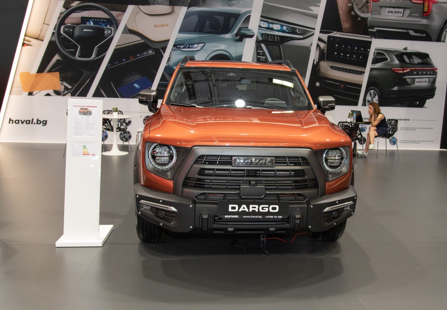 Front view of SUV with round LED headlights and black grille