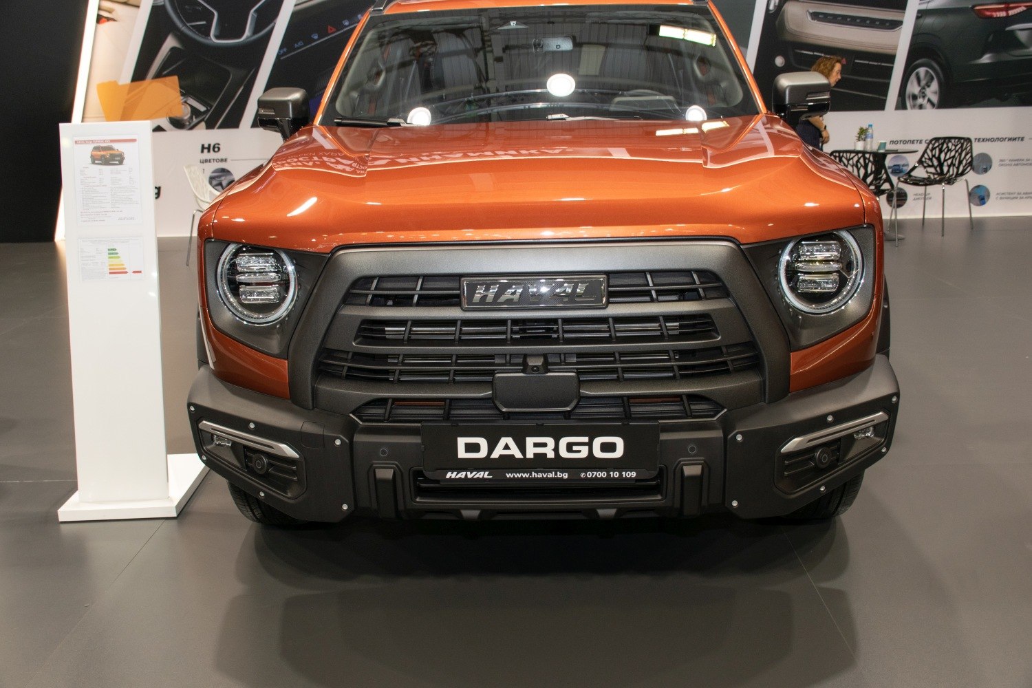 Bold front grille with circular LED headlights and rugged bumper design