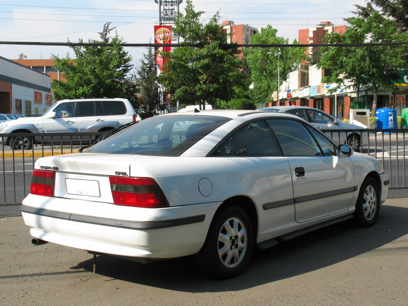 Rear and side view of a classic two-door coupe with distinctive taillights.