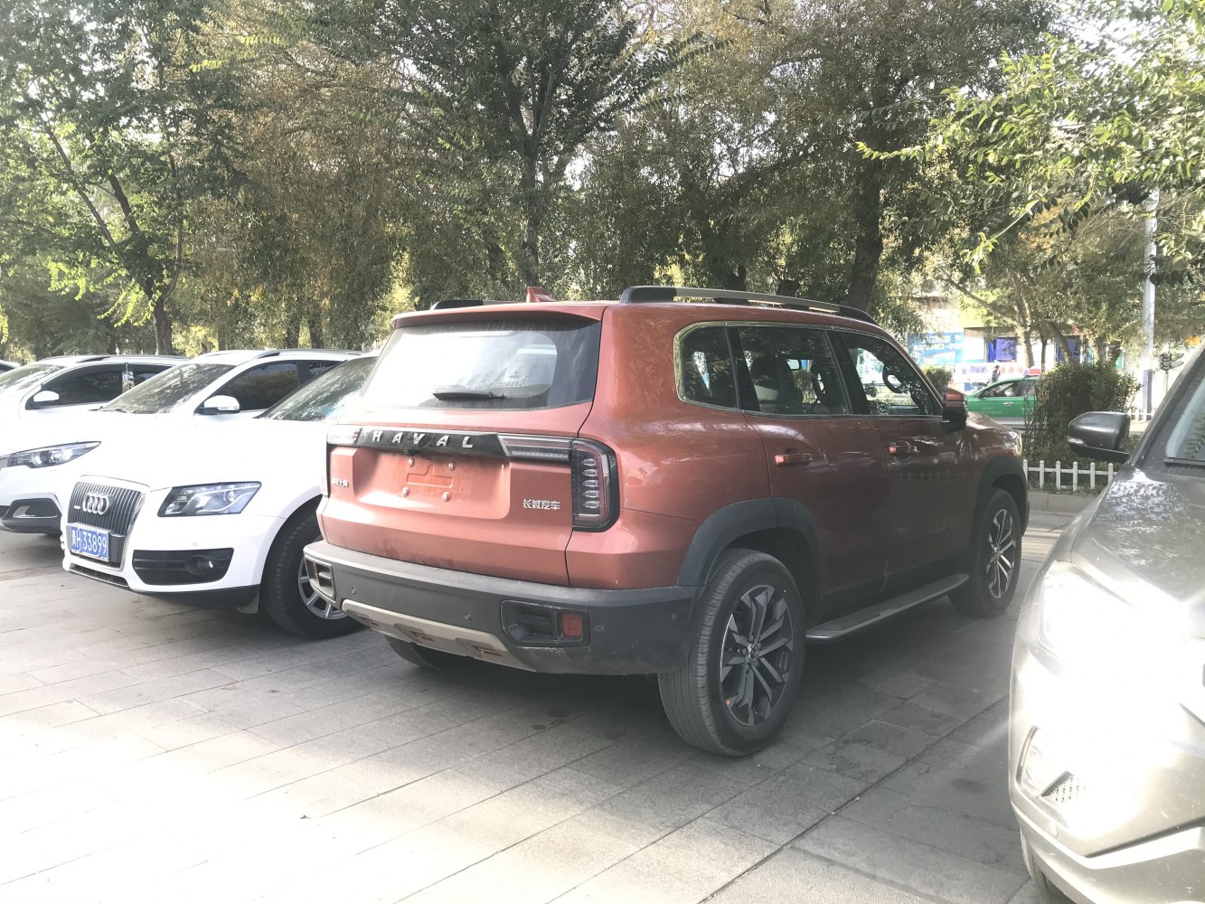Rear and side view of an SUV with distinctive taillights and black wheel arches