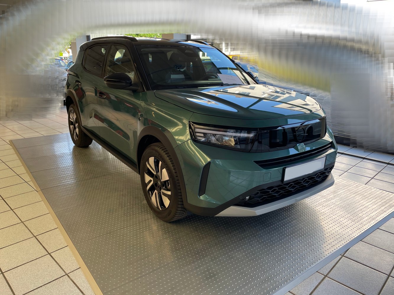 Front view of an SUV with modern LED headlights and aerodynamic design