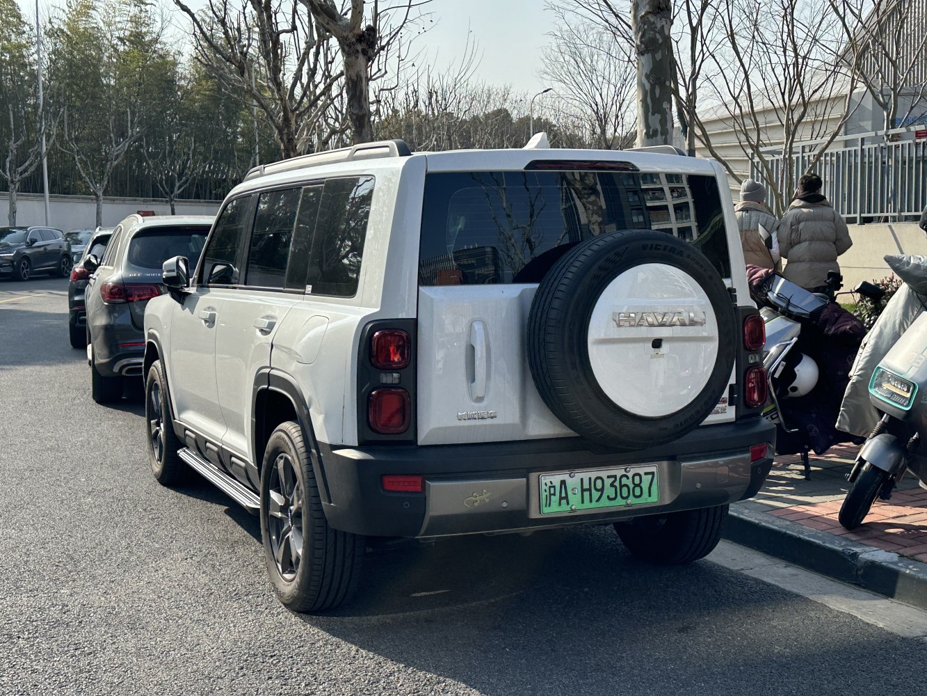 Rear view of SUV with rear-mounted spare tire and rectangular taillights