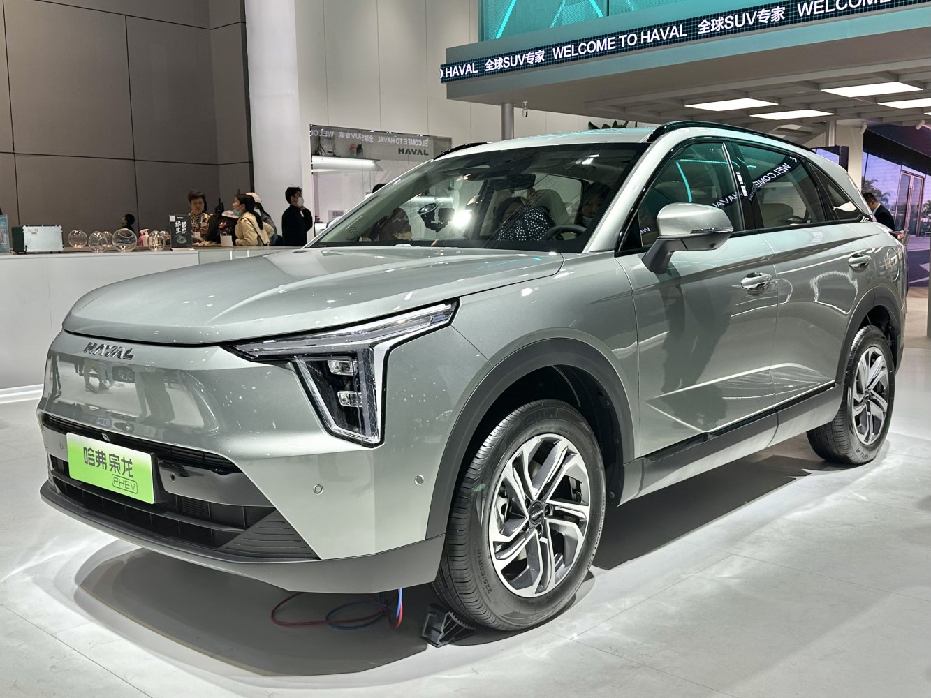 Modern electric SUV with distinctive LED headlights and aerodynamic body