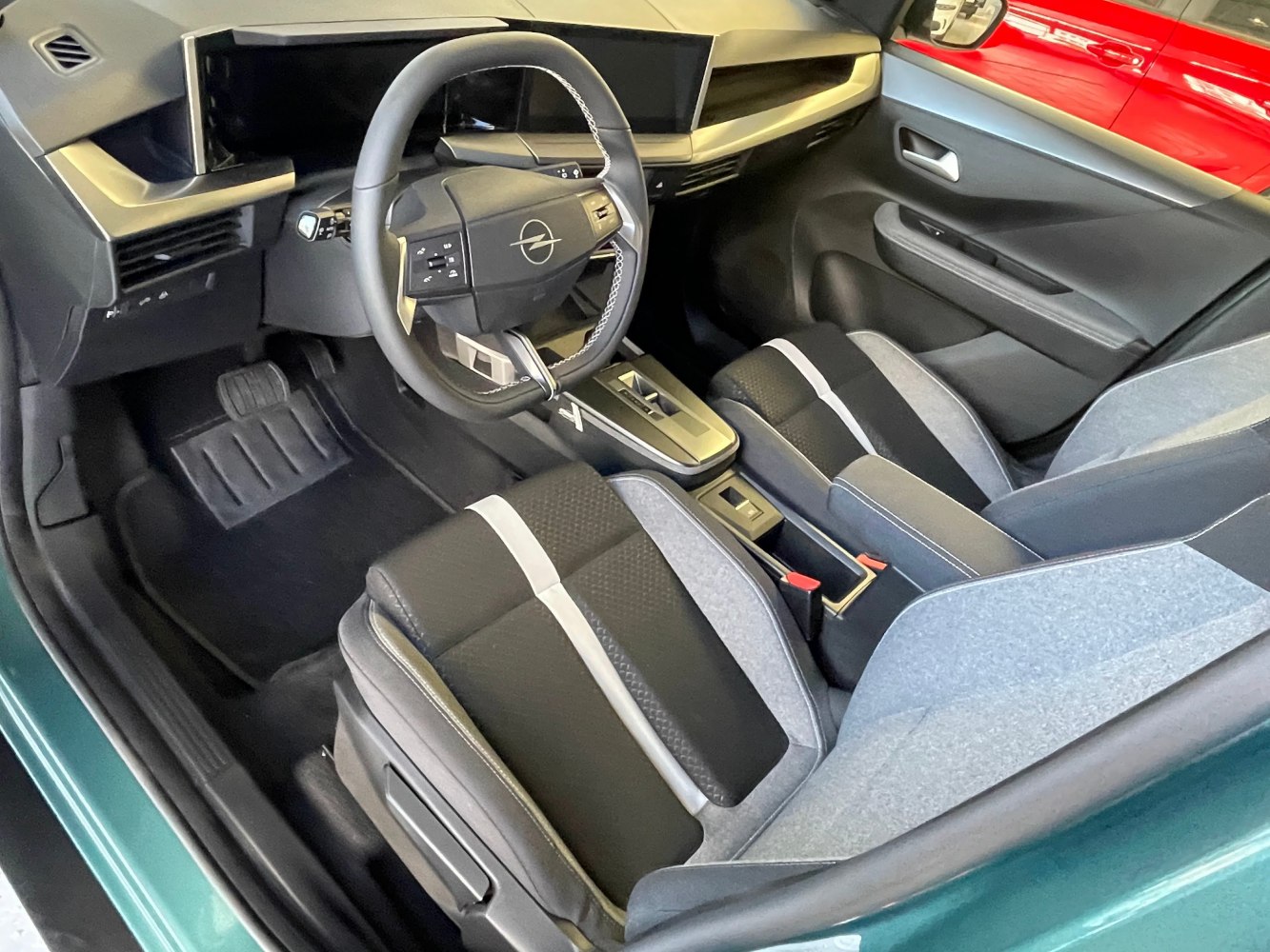 Modern steering wheel with digital dashboard and gear selector