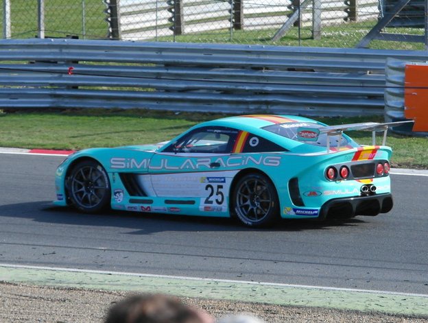 Sportscar rear and side profile with racing livery and rear spoiler