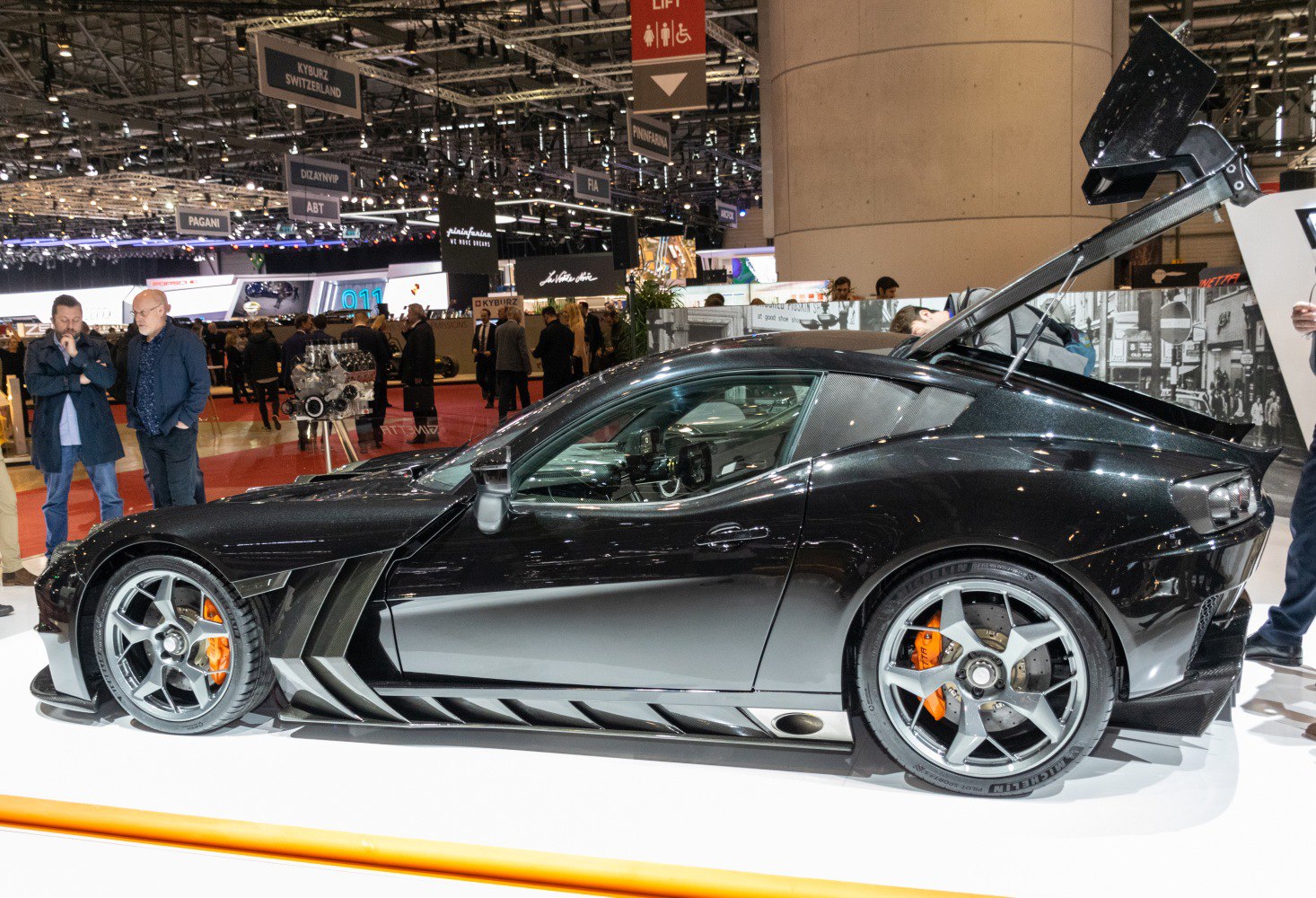 Sleek sports coupe with aerodynamic rear wing and performance brakes.