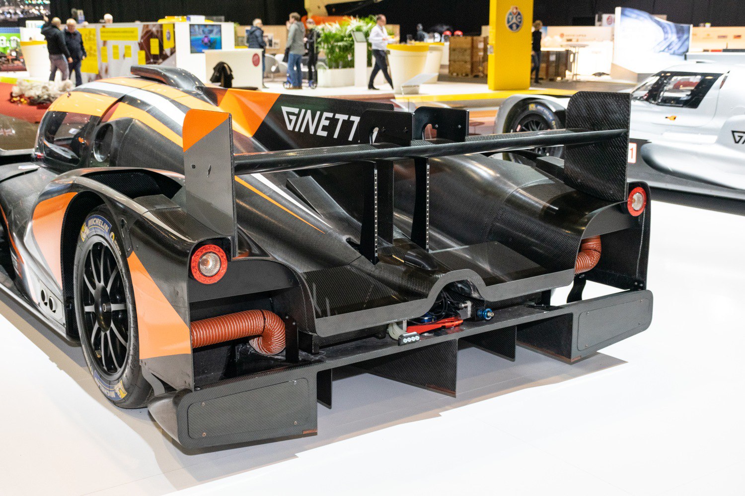 Rear aerodynamic features with carbon fiber wing and diffuser