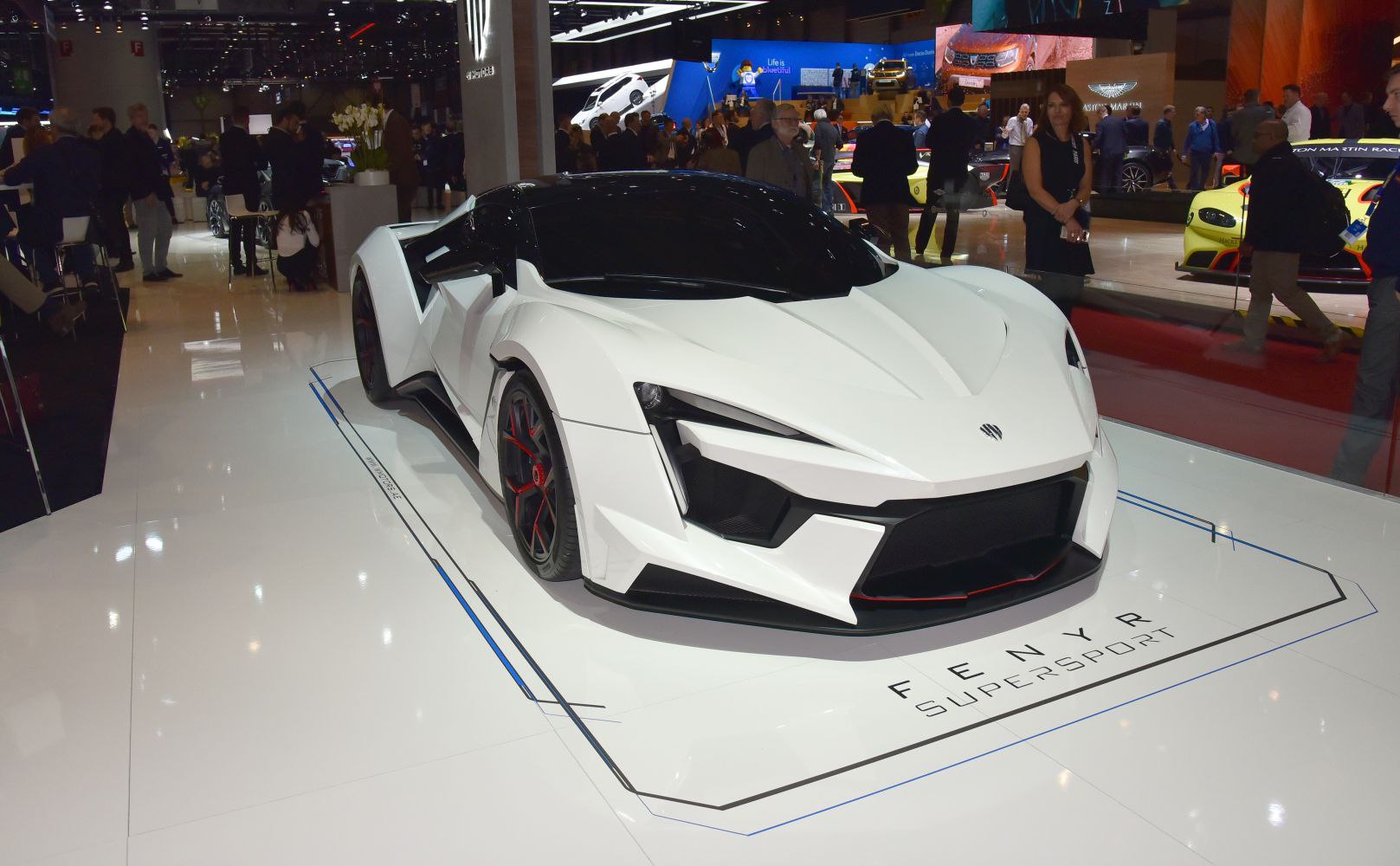 Angular headlights and aggressive front design of a white sports coupe