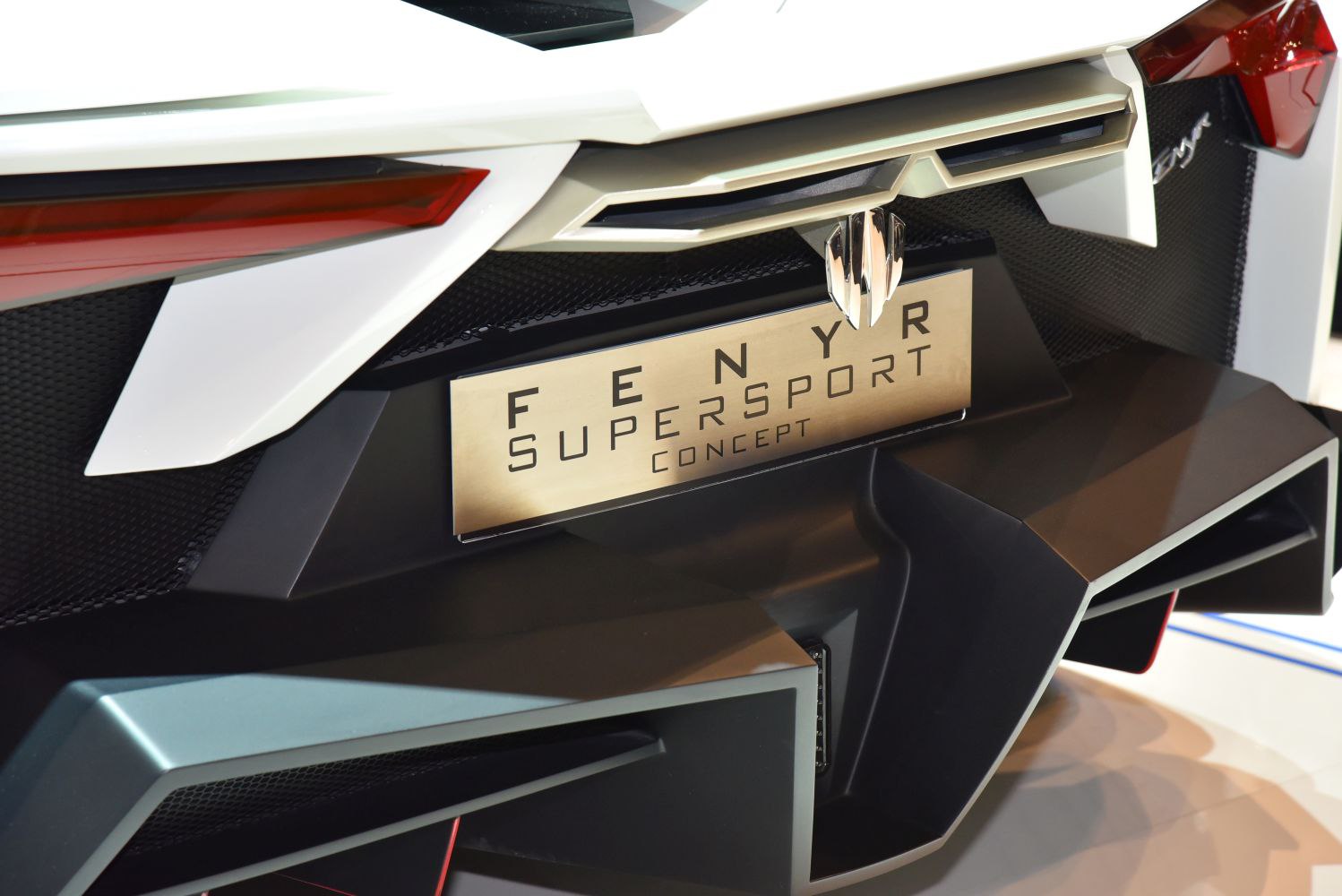 Close-up of aggressive rear diffuser and taillights with Fenyr SuperSport Concept badge