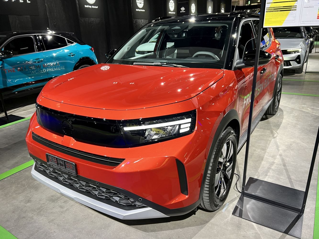Front red SUV with LED headlights and sporty grille