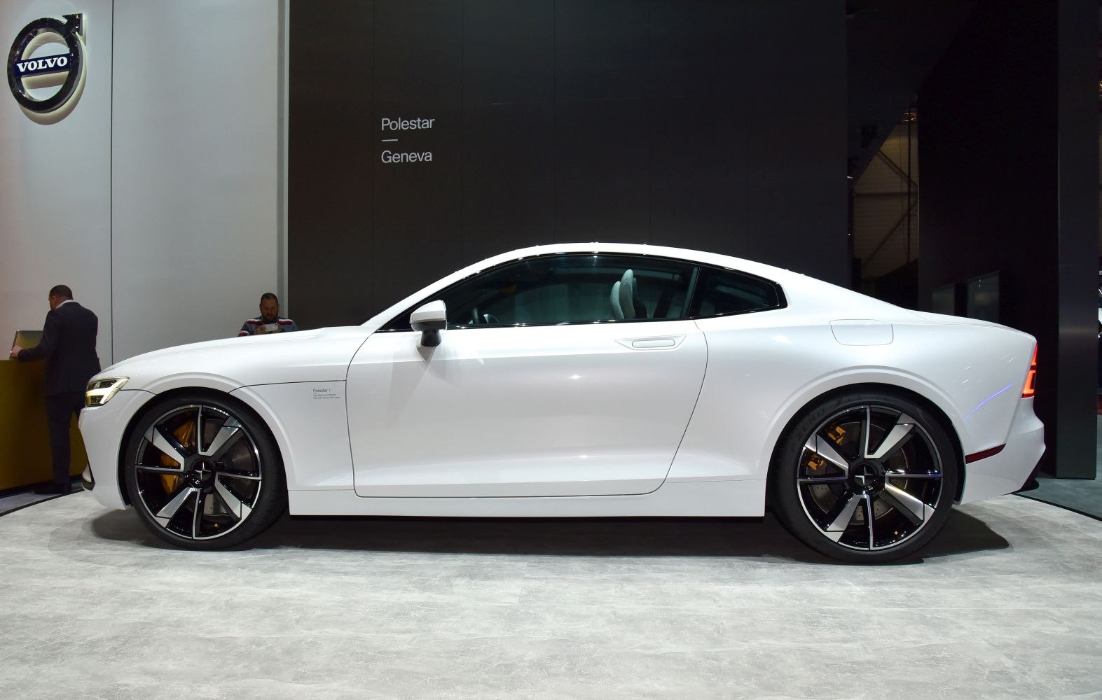 Sleek coupe side profile with distinctive large alloy wheels and aerodynamic design.