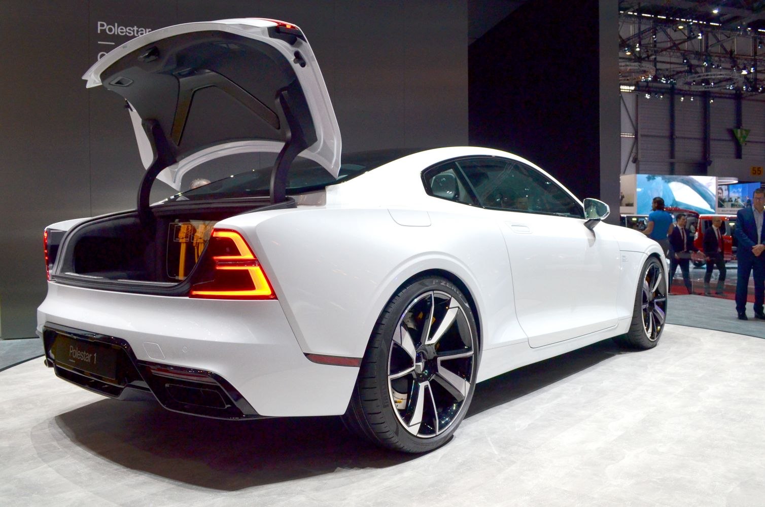 Rear view with open trunk, illuminated LED taillights, stylish alloy wheels