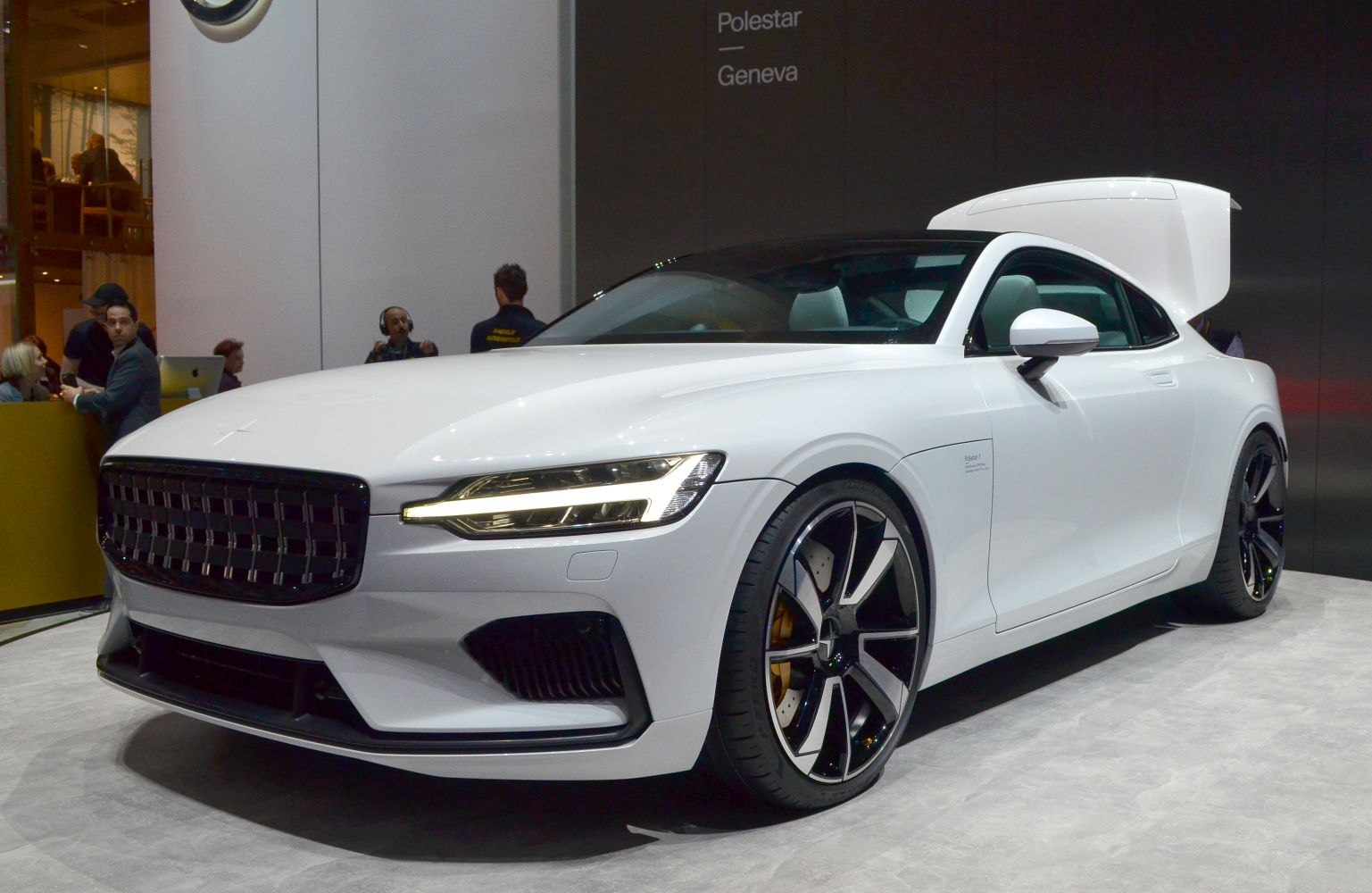 Front view of electric coupe with LED headlights and black grille