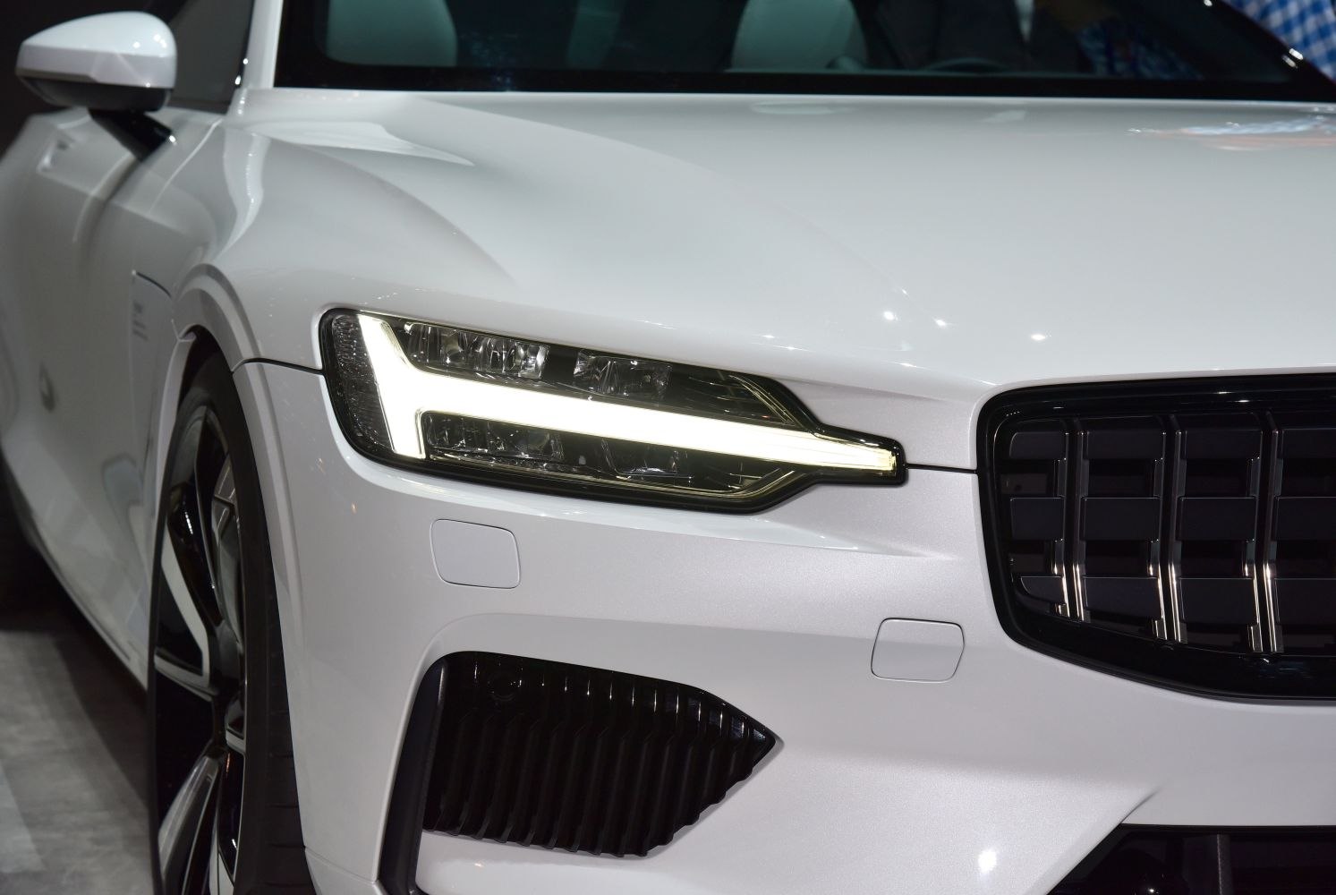 Close-up of front LED headlight and grille design
