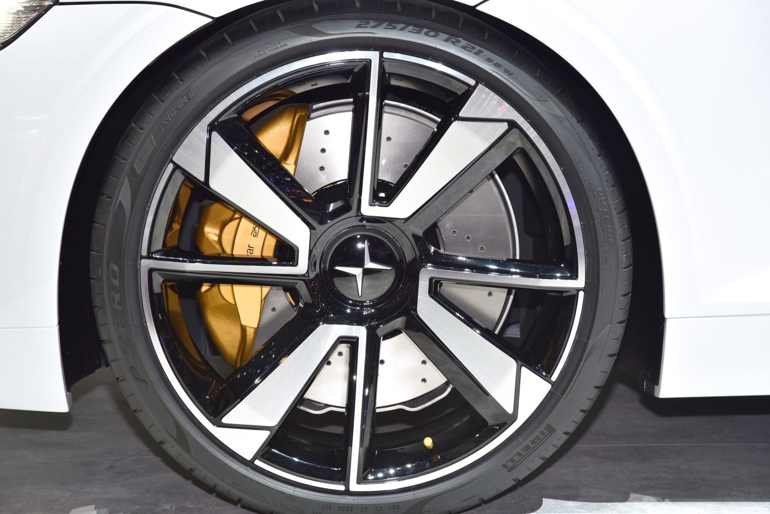 Black and silver alloy wheel with gold brake caliper