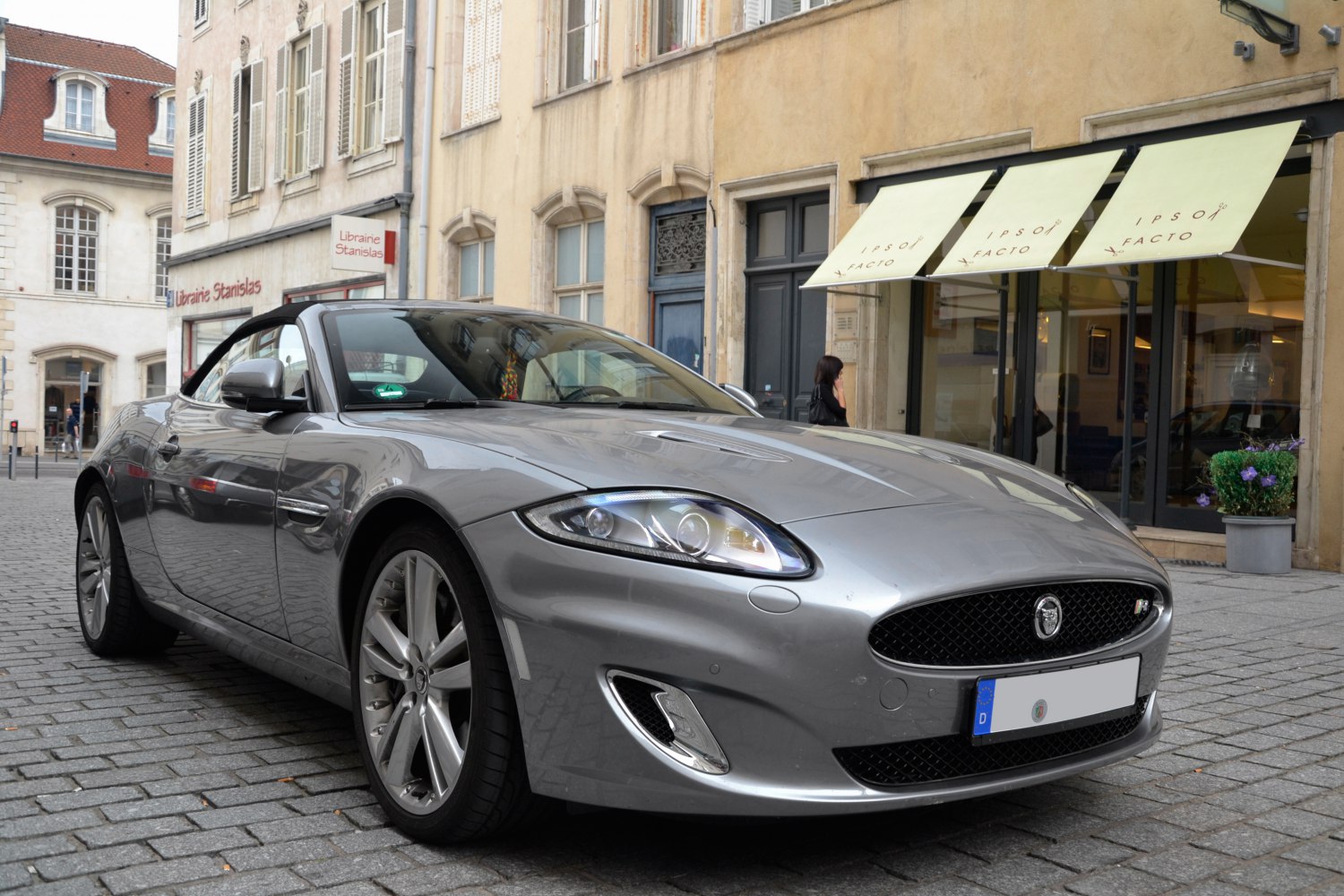 Silver convertible sports car front view with alloy wheels