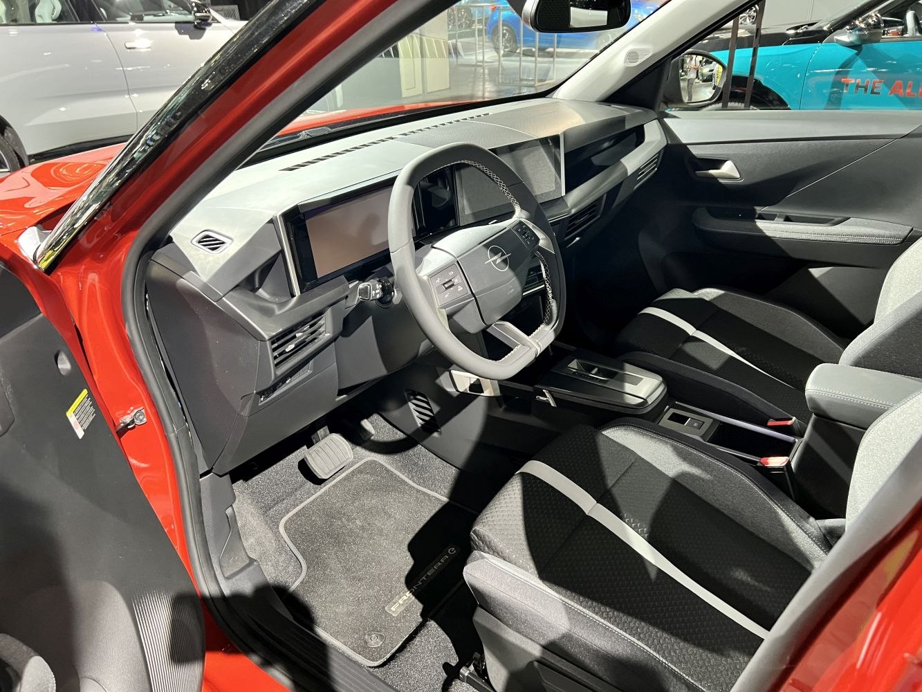 Modern digital dashboard and ergonomic front seats in car interior