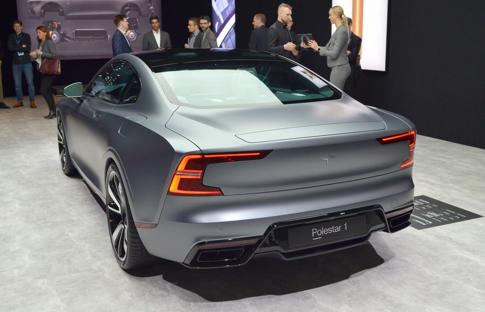 Rear view of a sporty coupe with LED tail lights and matte finish