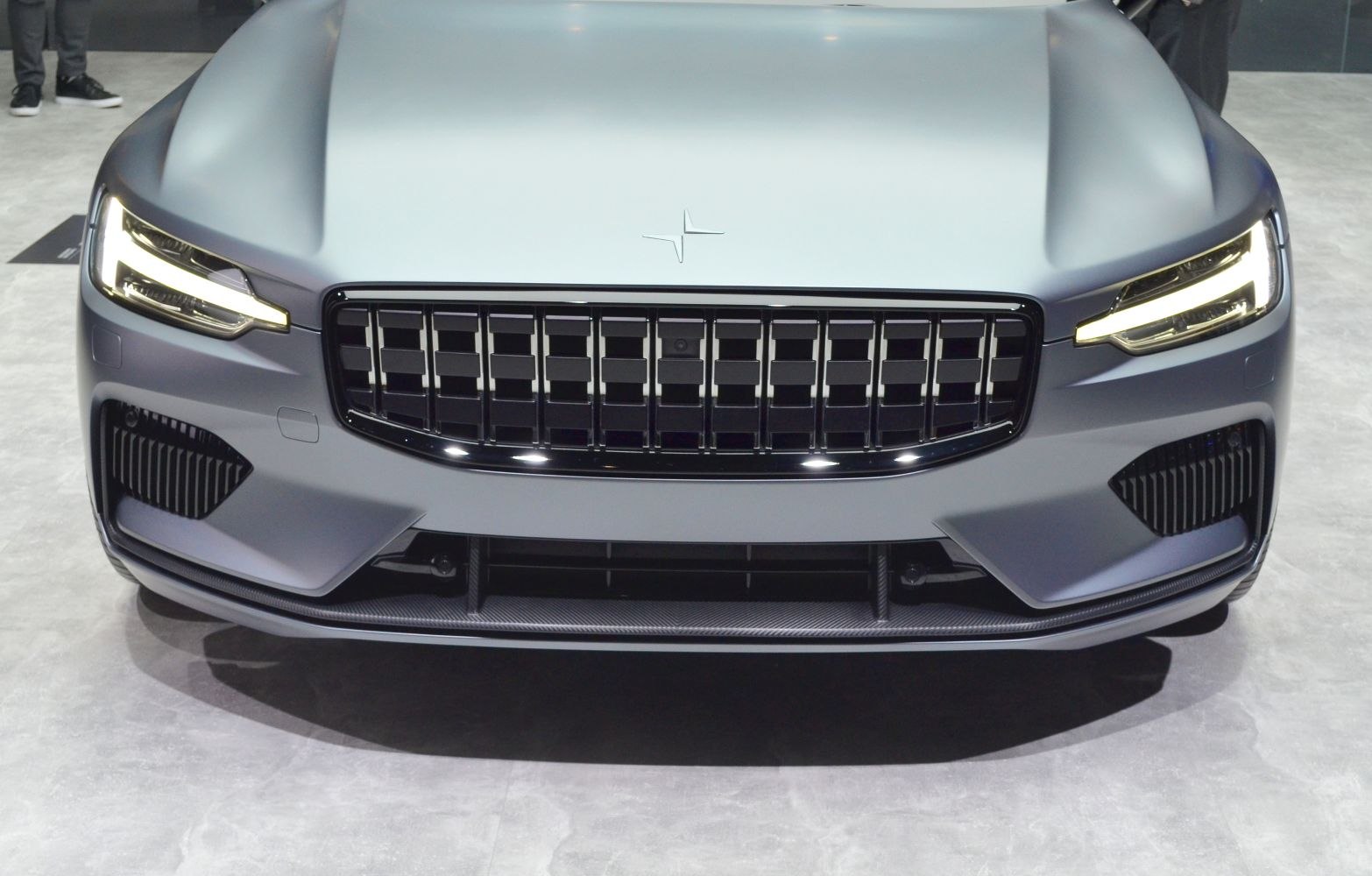 Front grille and LED headlights of a sleek modern car