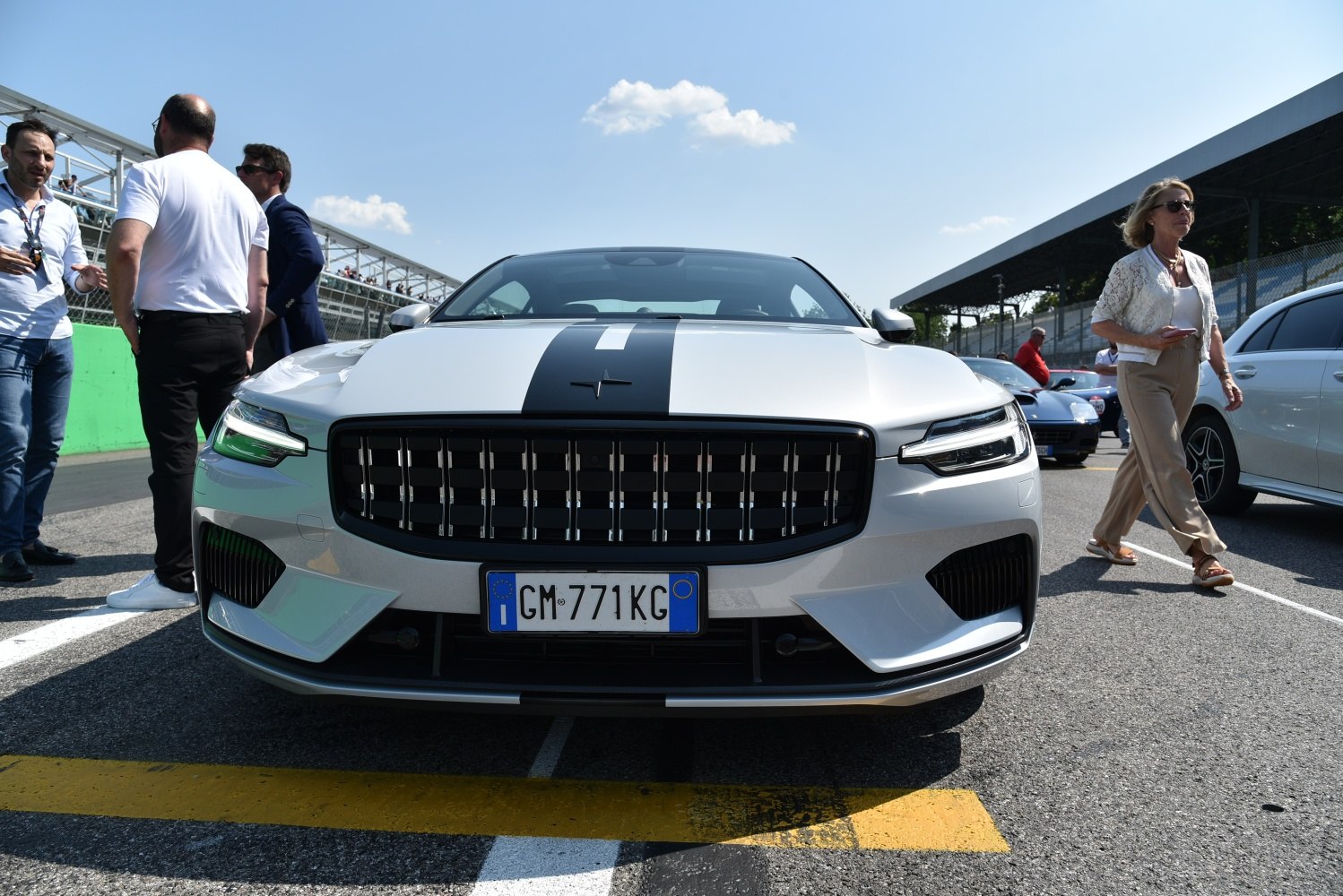 Front profile with black racing stripe and distinctive grille