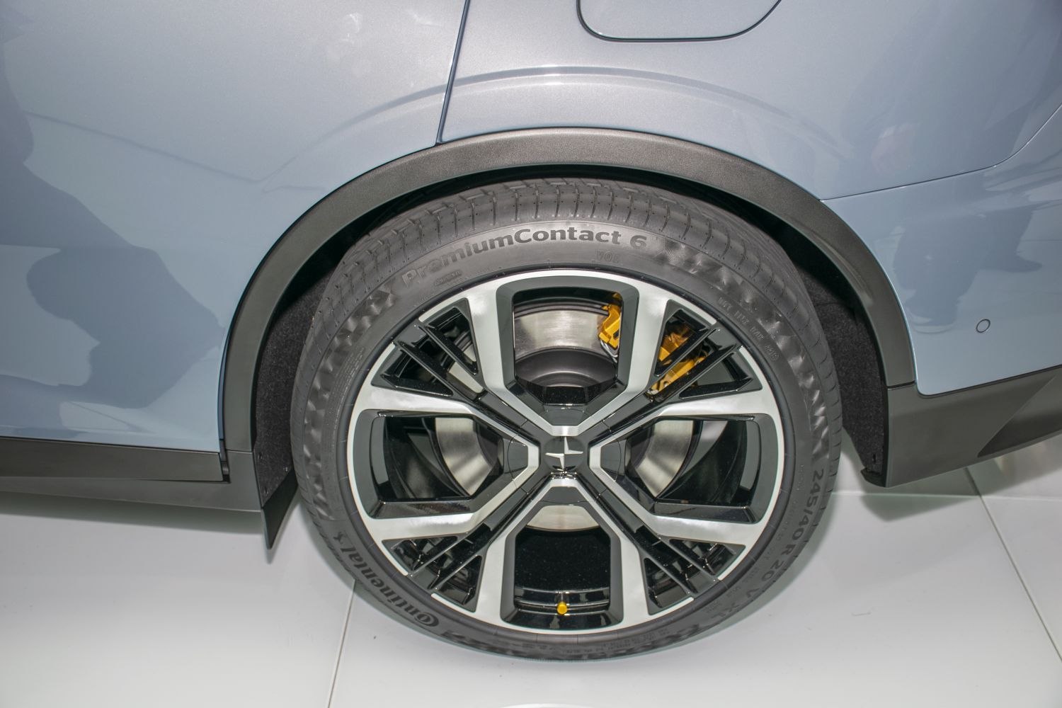 Alloy wheel with yellow brake caliper on modern vehicle