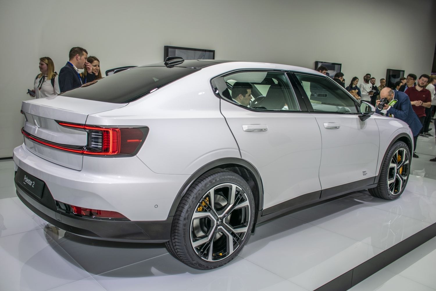 Rear side view with distinct taillights and unique alloy wheel design