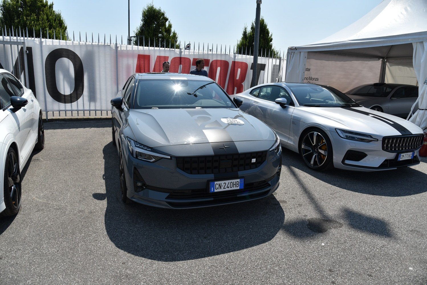 Gray vehicle front with racing stripe and distinctive grille