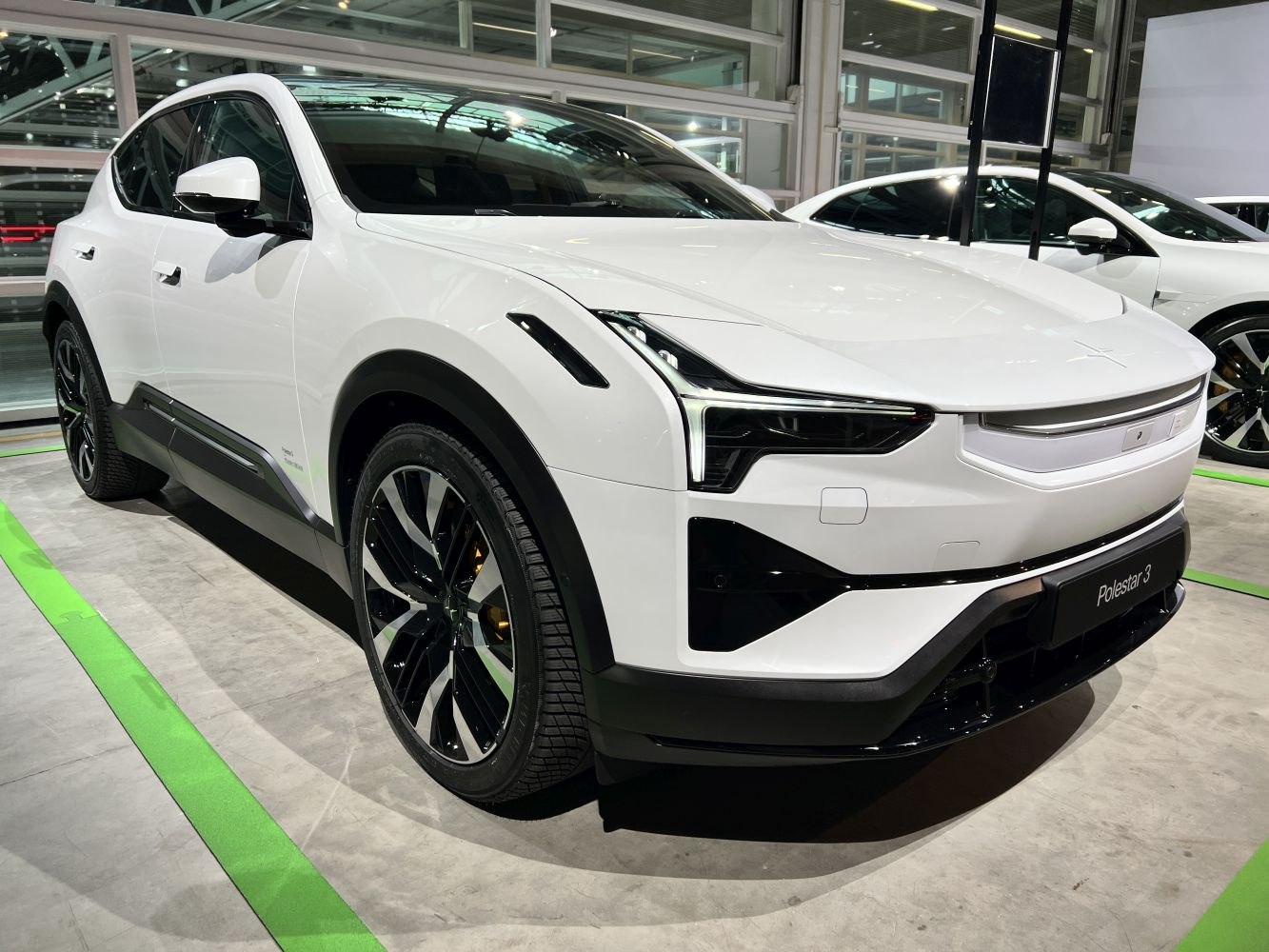 Front-side view of electric SUV with LED headlights and black alloy wheels