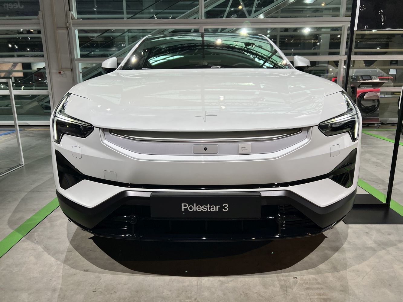 Close-up of front view with LED headlights and modern grille design.
