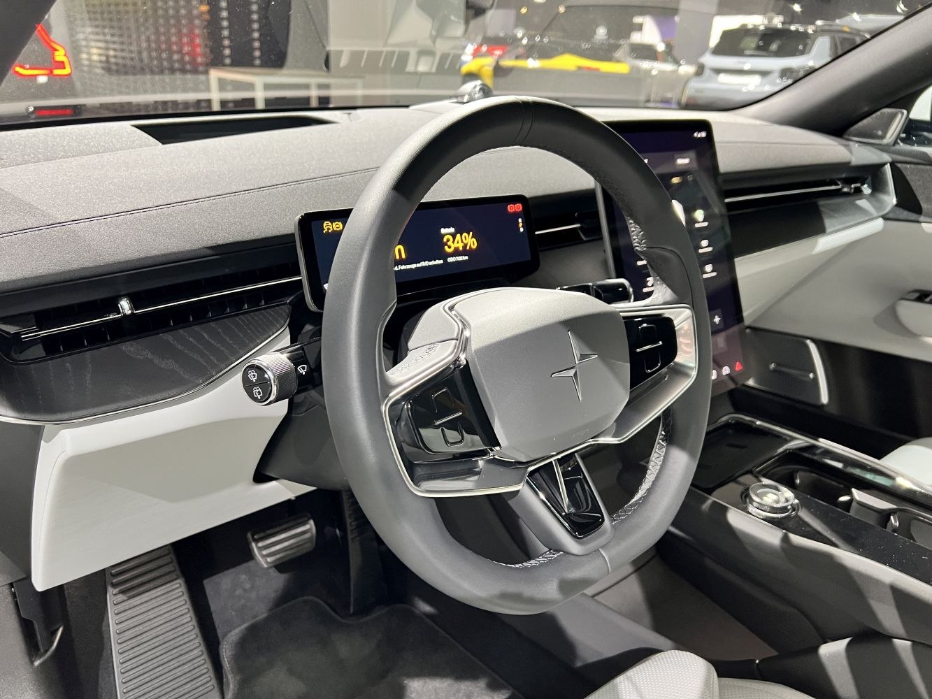 Modern dashboard with digital displays and unique steering wheel