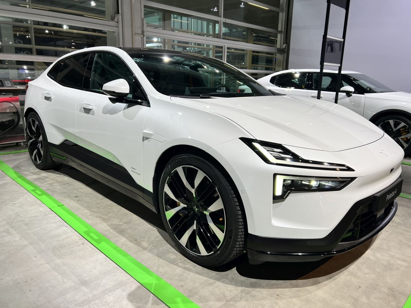 Front angle view with sharp LED headlights and distinctive alloy wheels