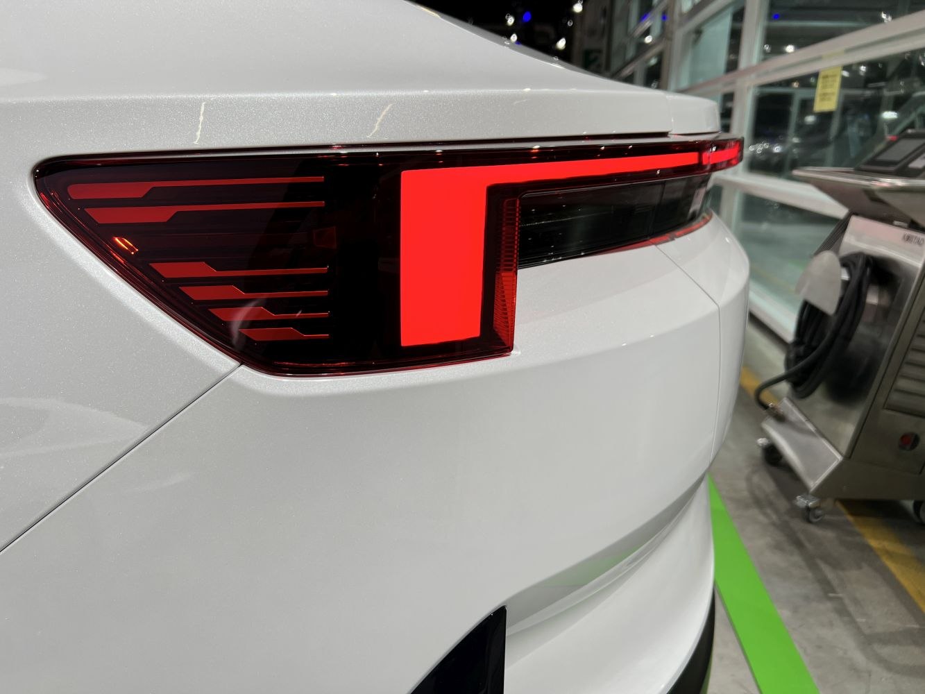 Close-up of a modern LED rear taillight with sleek, angular light elements.