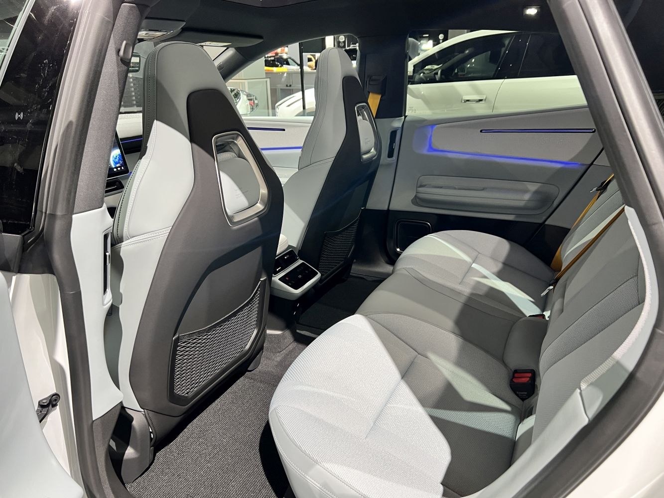 Rear seats with modern design and ambient blue lighting