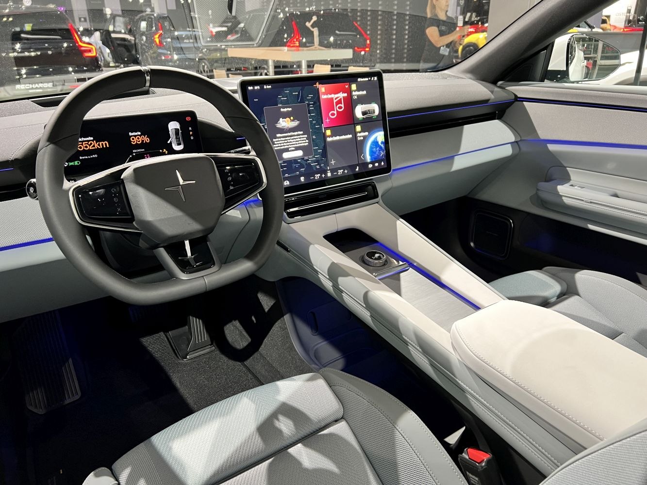 Digital instrument cluster and large central touchscreen in elegant modern interior