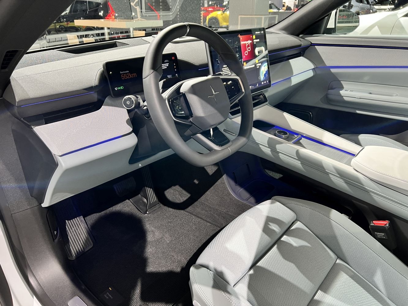 Digital dashboard and steering wheel with ambient lighting in a modern car interior
