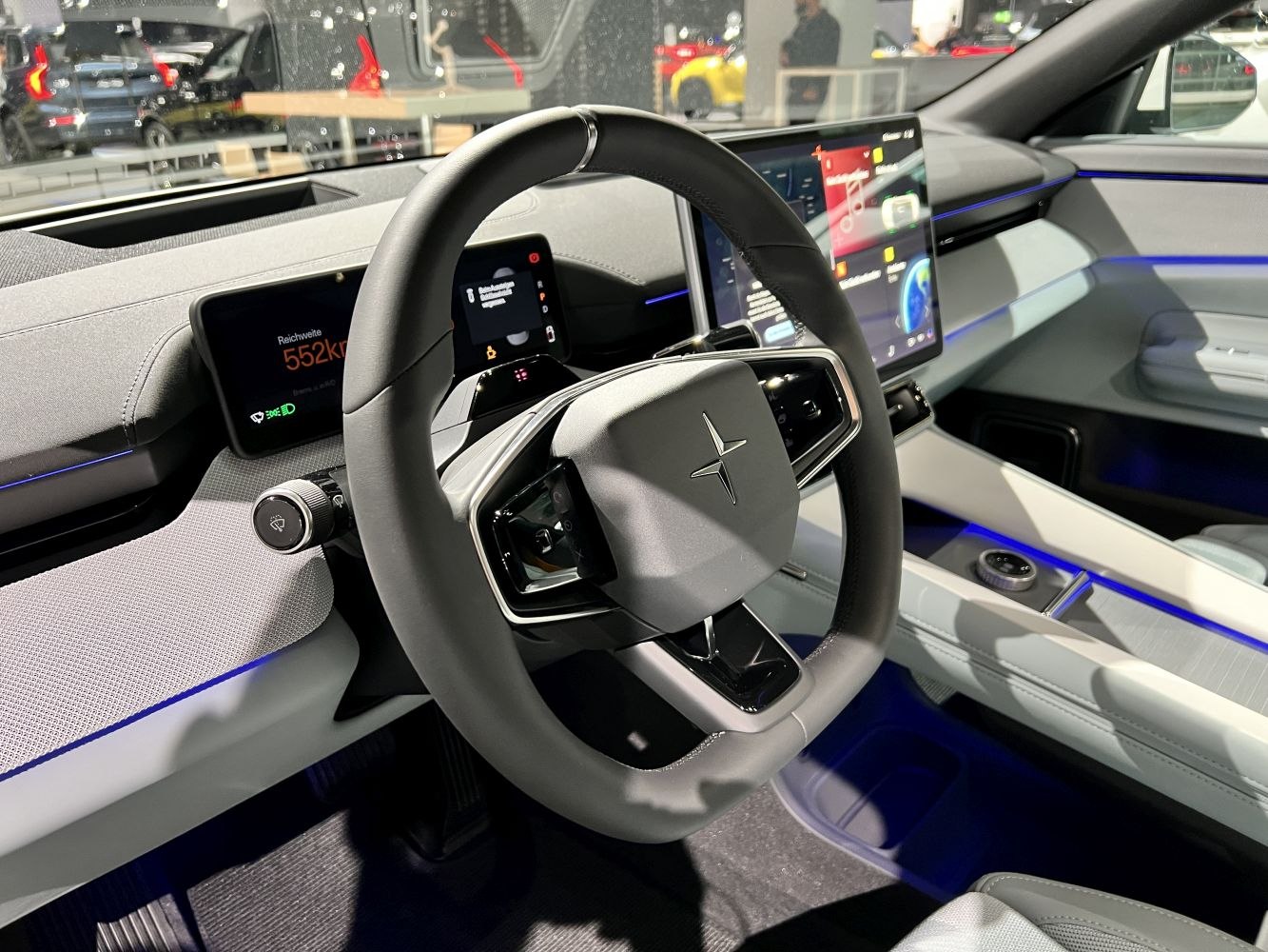 Modern steering wheel and digital dashboard with ambient lighting