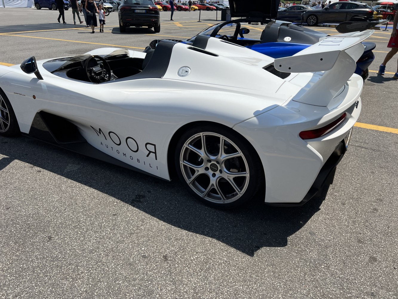 Aerodynamic rear spoiler and open cockpit on a sleek sports car