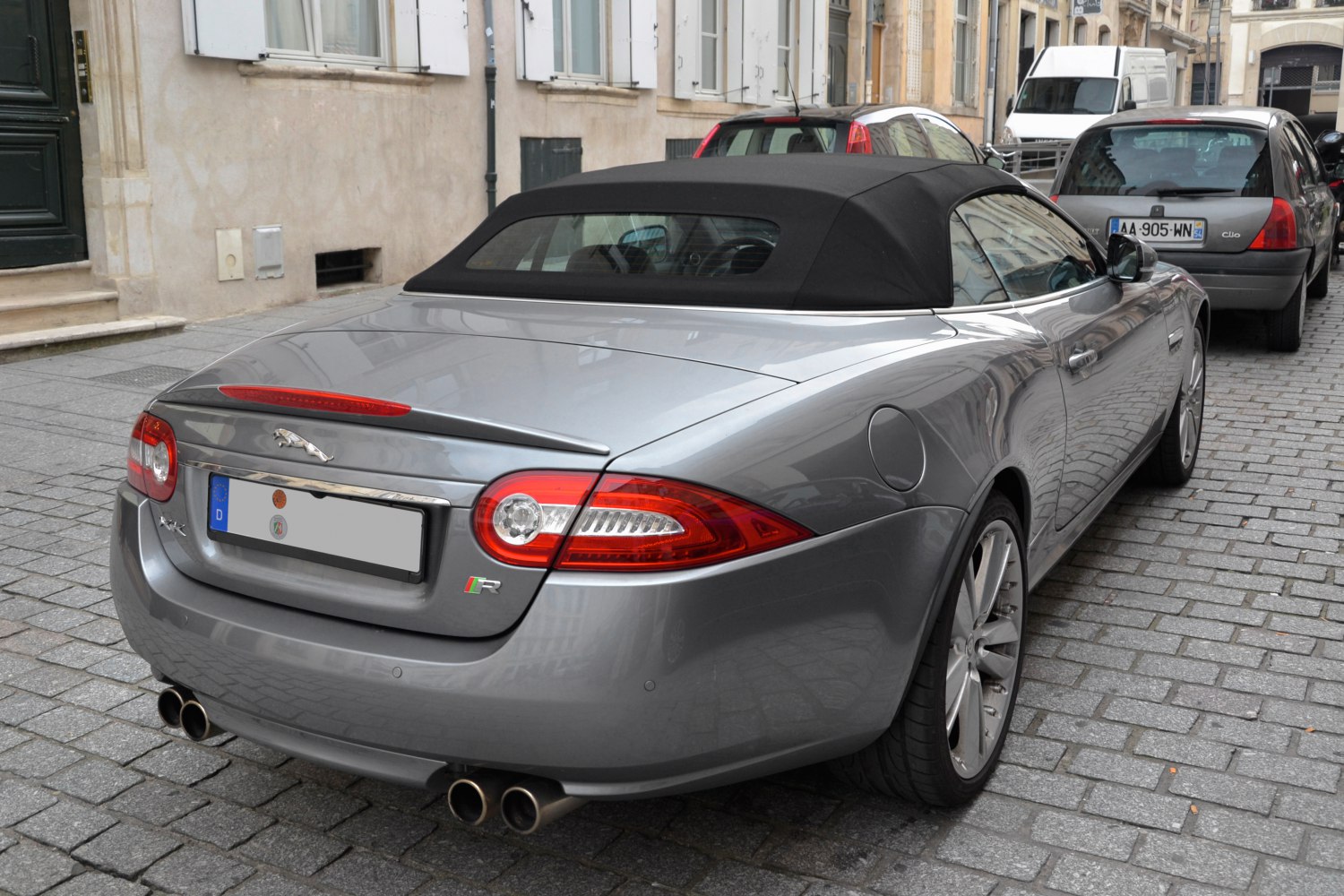 Rear view of luxury convertible with dual exhaust and distinctive tail lights