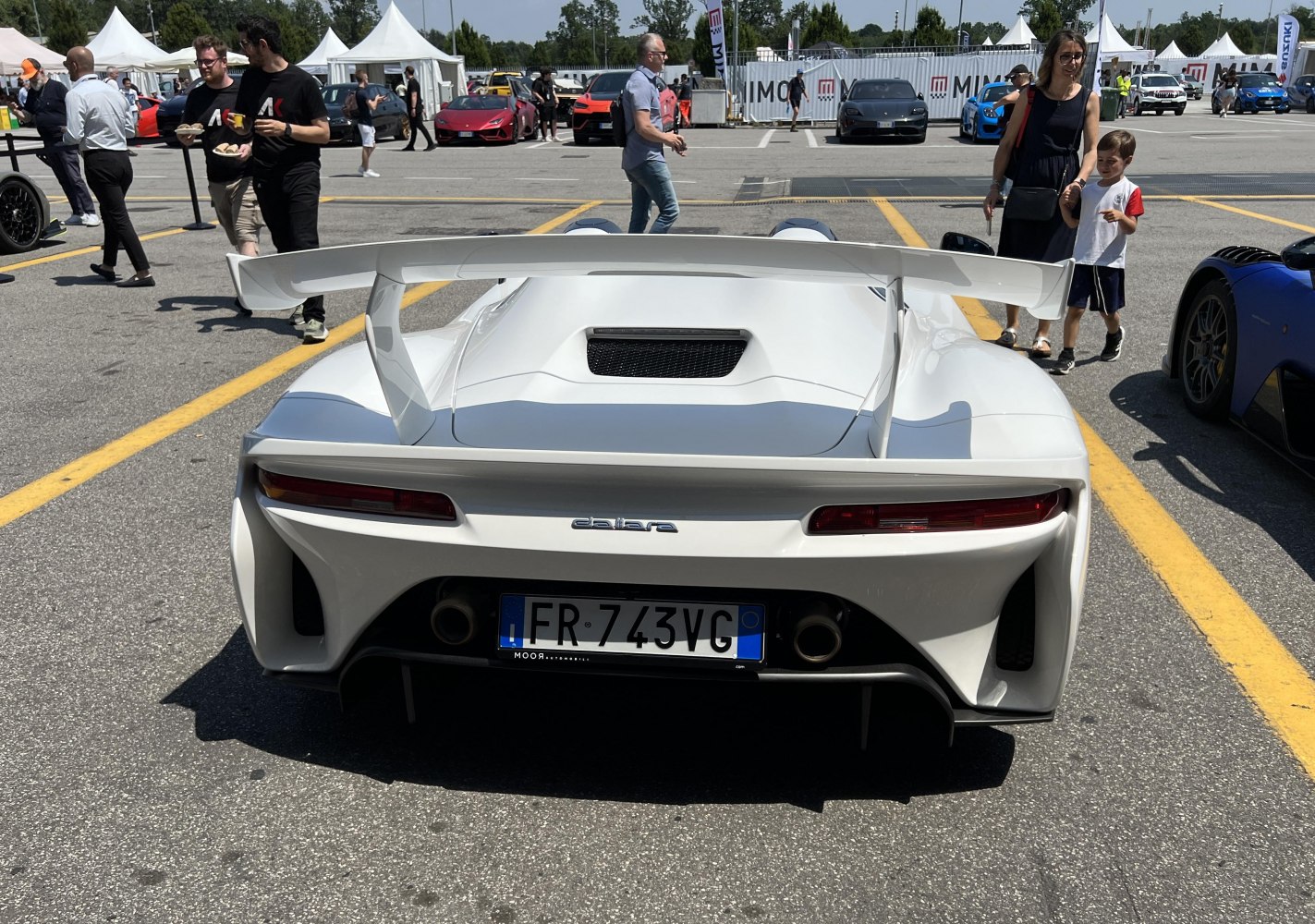 Rear profile with large spoiler and dual exhaust setup