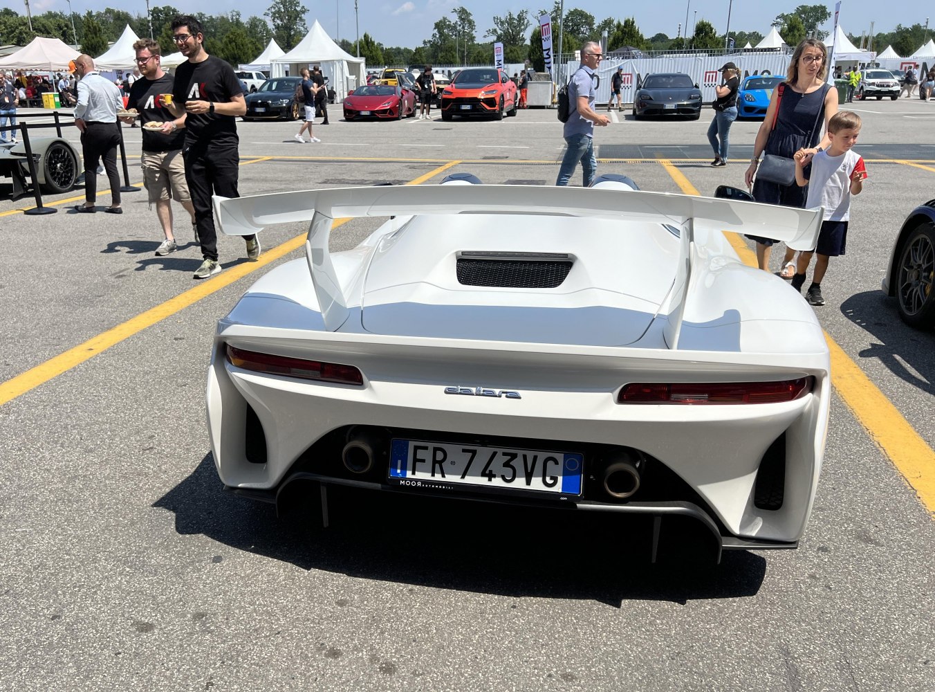 Rear view with large spoiler and dual exhausts
