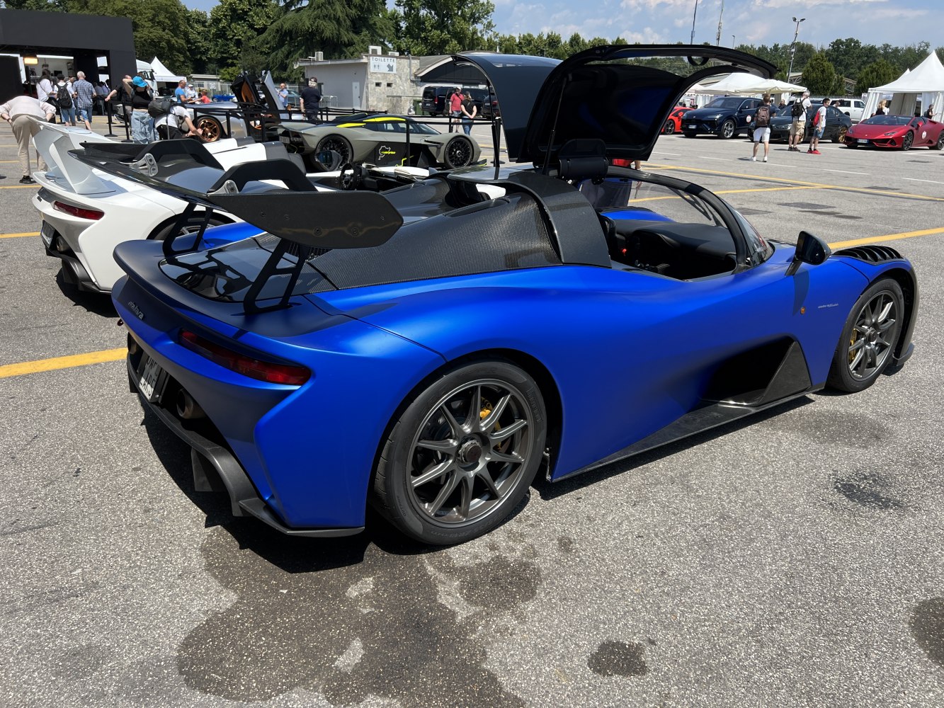 Aerodynamic rear wing and lightweight wheels on open cockpit sports car