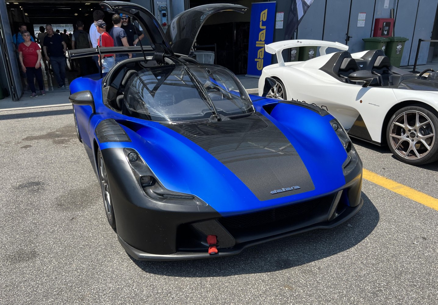 Front view with carbon fiber hood and gullwing doors open