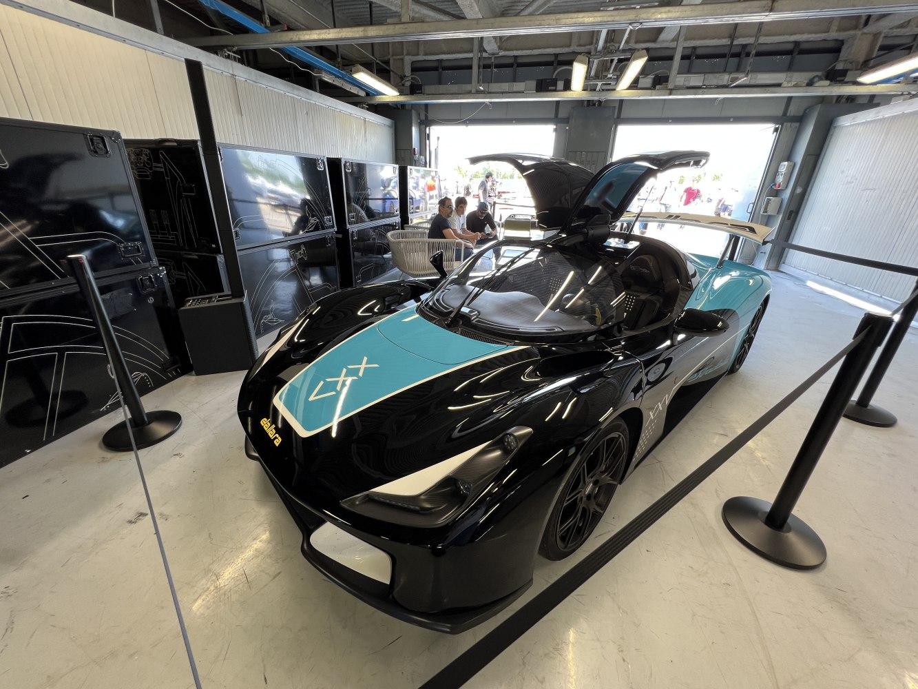 Sports car with gullwing doors and aerodynamic design