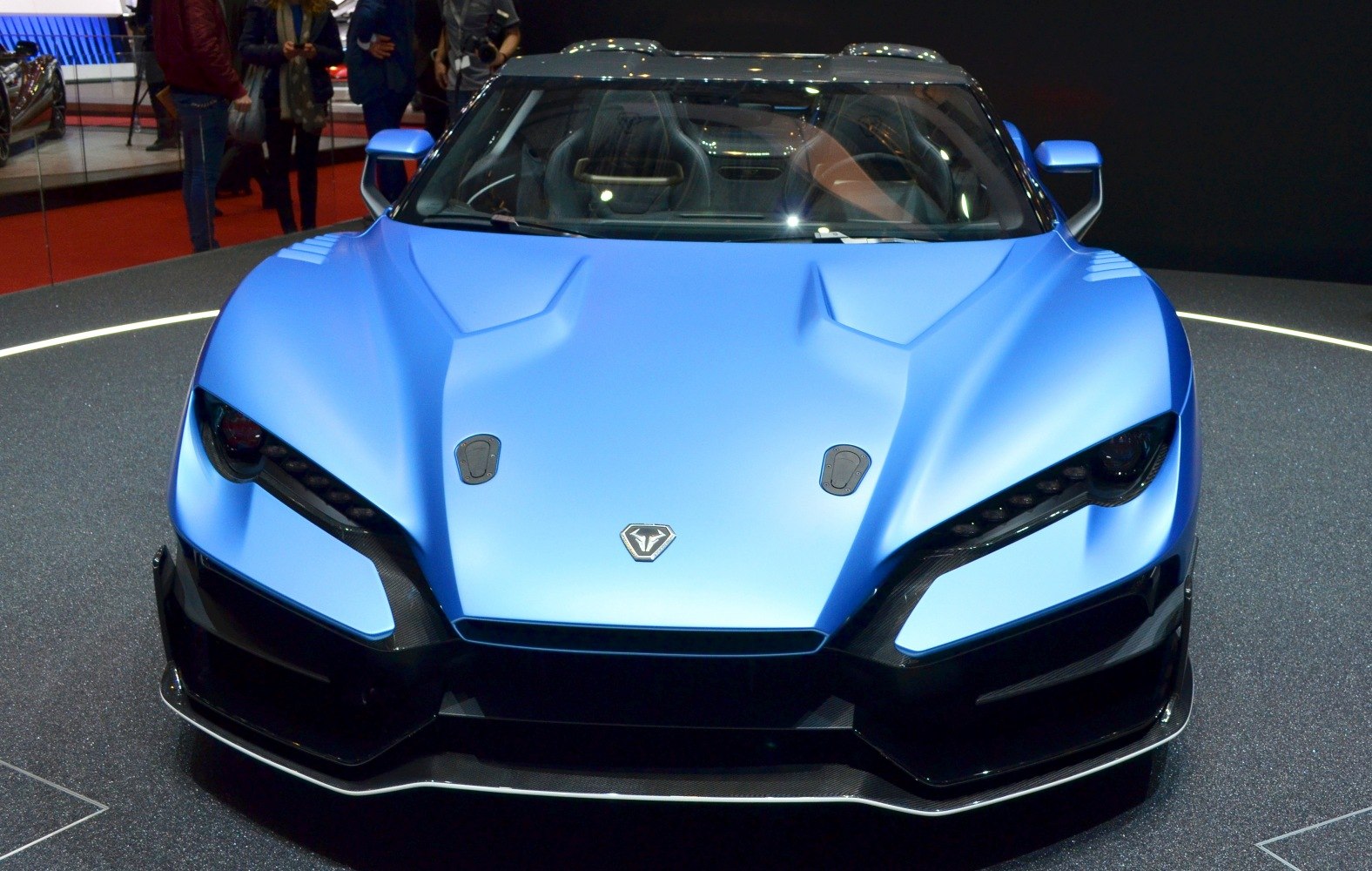 Aerodynamic hood with LED headlights and sharp front design