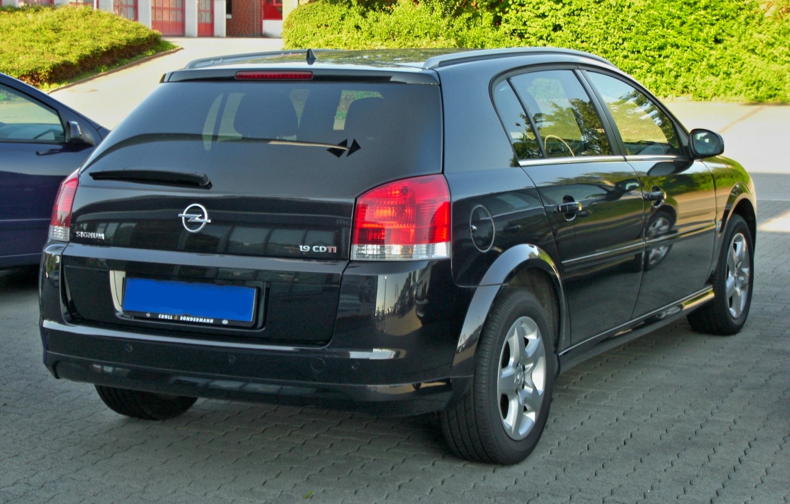 Black estate with tinted rear windows and roof rails
