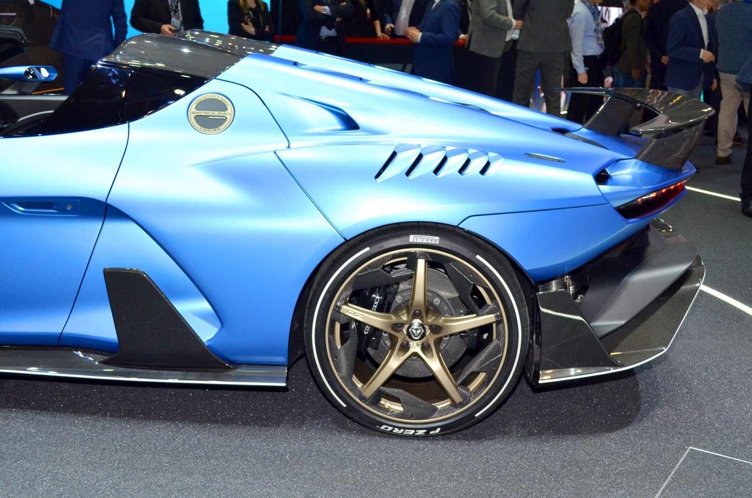 Rear side with bronze alloy wheel and aerodynamic features