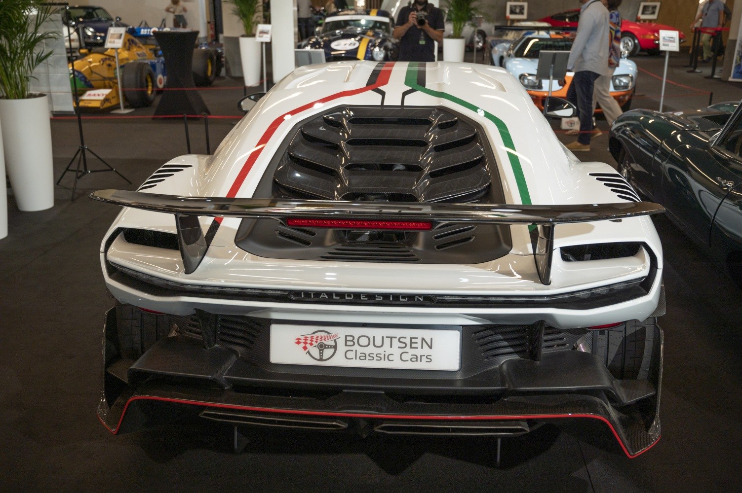 Rear view with large aerodynamic wing and ventilated engine cover