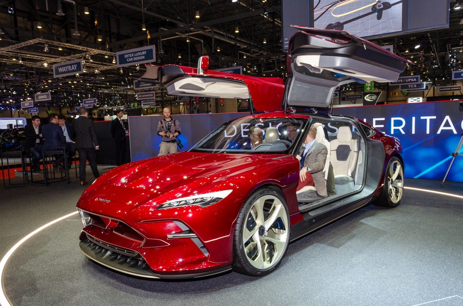 Bright gullwing door sports car with futuristic modern design.