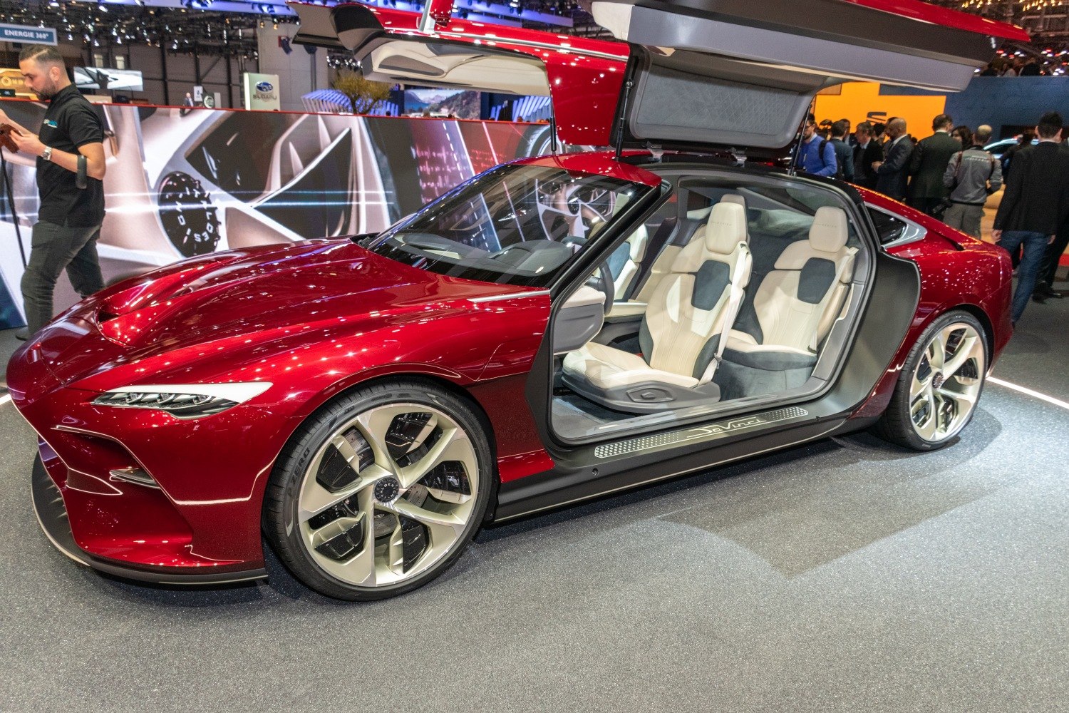 Futuristic gullwing door and luxury white interior seating